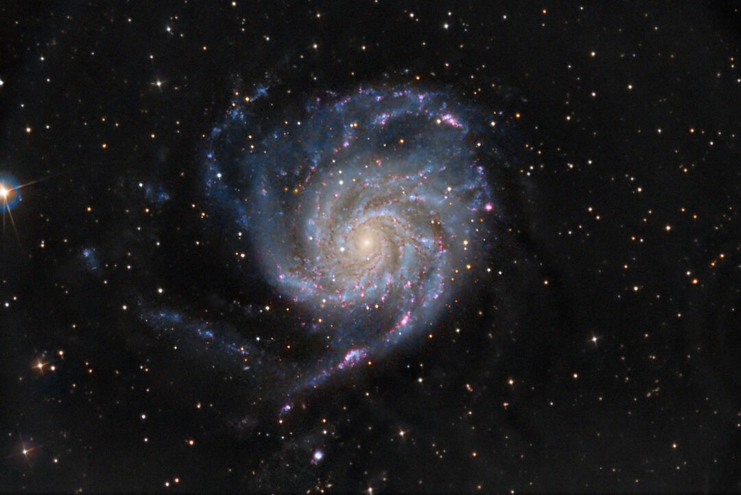 How far away are the Pinwheel Galaxy Planets? it is located in the constellation Ursa Major, approximately 21 million light-years from Earth.